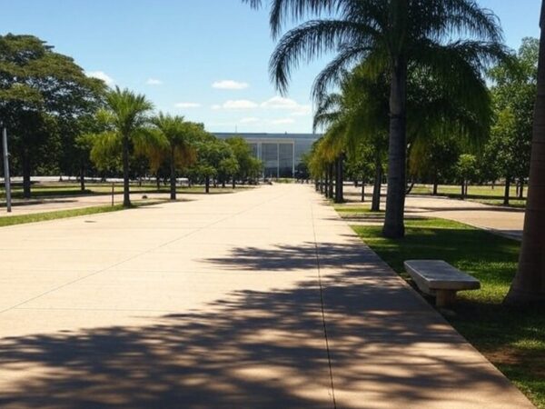 Rua em Brasília com elementos de inclusão social para pessoas em situação de rua, ao fundo o Congresso Nacional.